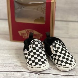 Checkered black & white slip on crib vans, size 3.